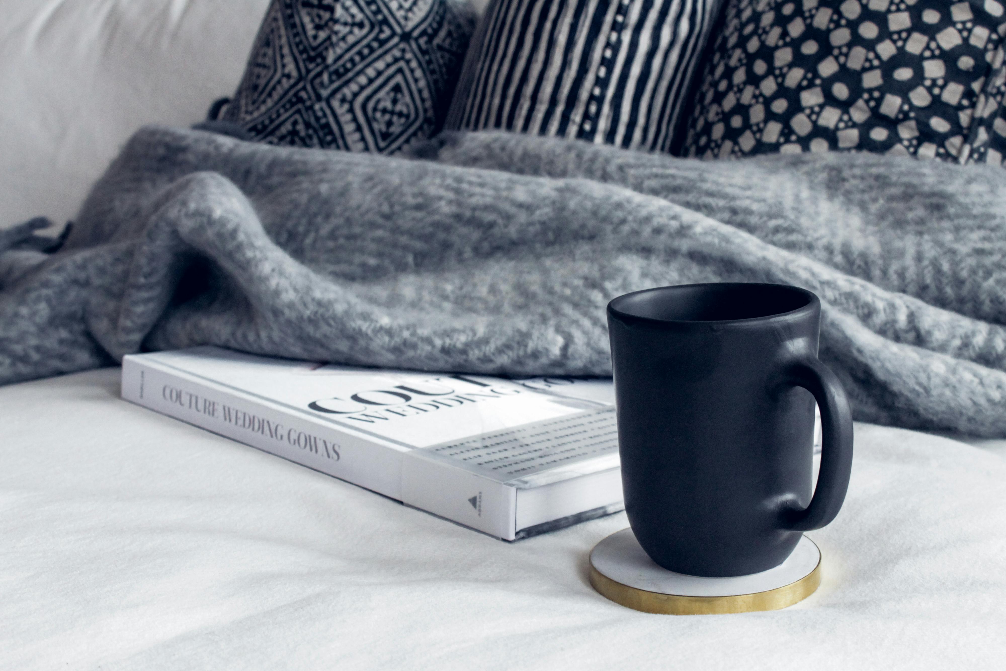 A book and a cup of coffee on the table